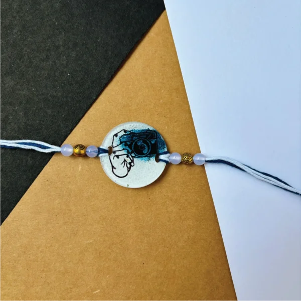 Camera themed painted rakhi