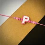 Alphabet rakhi - gray