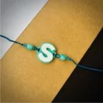 Alphabet rakhi - cyan
