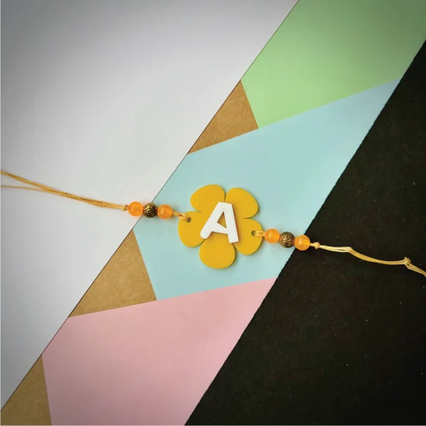 Alphabet flower rakhi - yellow
