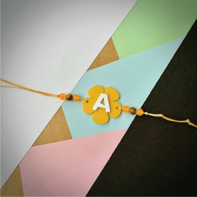 Alphabet flower rakhi - yellow