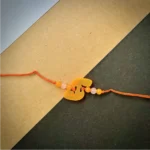 Radium name alphabet rakhi - orange