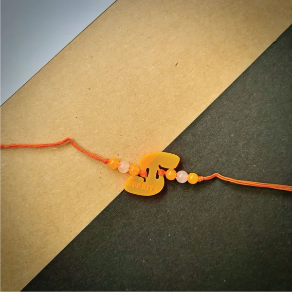 Radium name alphabet rakhi - orange