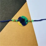 Peacock painted rakhi