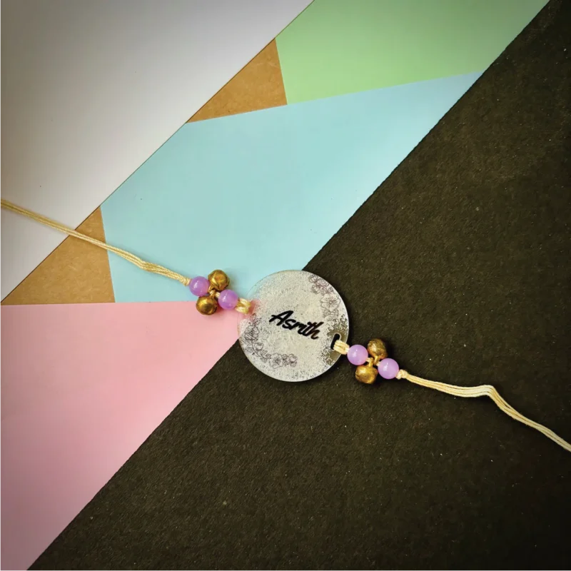 Name painted rakhi - silver