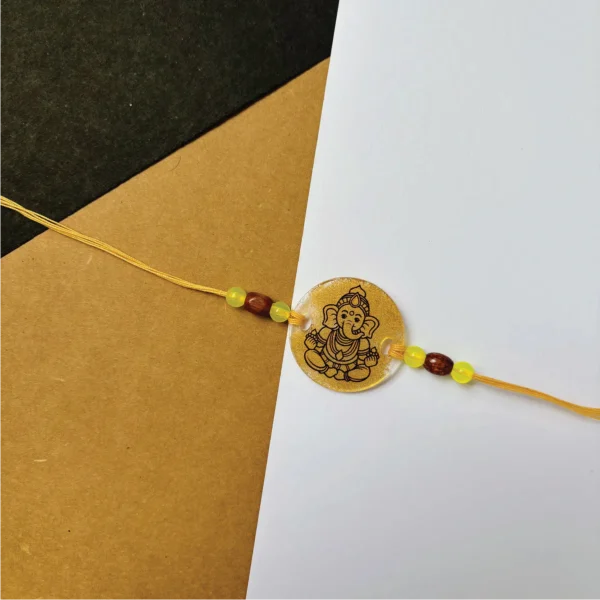 Gold painted vinayaka rakhi