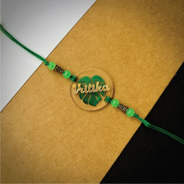 Gold name on leaf printed rakhi