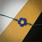 Flower smiley name rakhi - blue