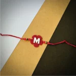 Flower alphabet rakhi - red