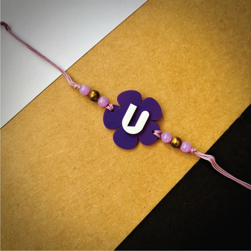 Flower alphabet rakhi - purple